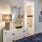 Bedroom with dresser, walk-in closet, and en-suite bathroom at Hermann Park Lofts.