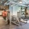 State-of-the-art fitness center with strength training machines, cardio equipment, and functional training space at Hermann Park Lofts.