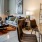 Stylish living room with sofa, coffee table, and balcony access at Hermann Park Lofts.
