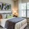 Spacious bedroom with large window, contemporary décor, and natural light at Hermann Park Lofts.